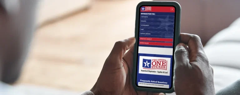 Texas vehicle inspection sticker displayed on a cell phone